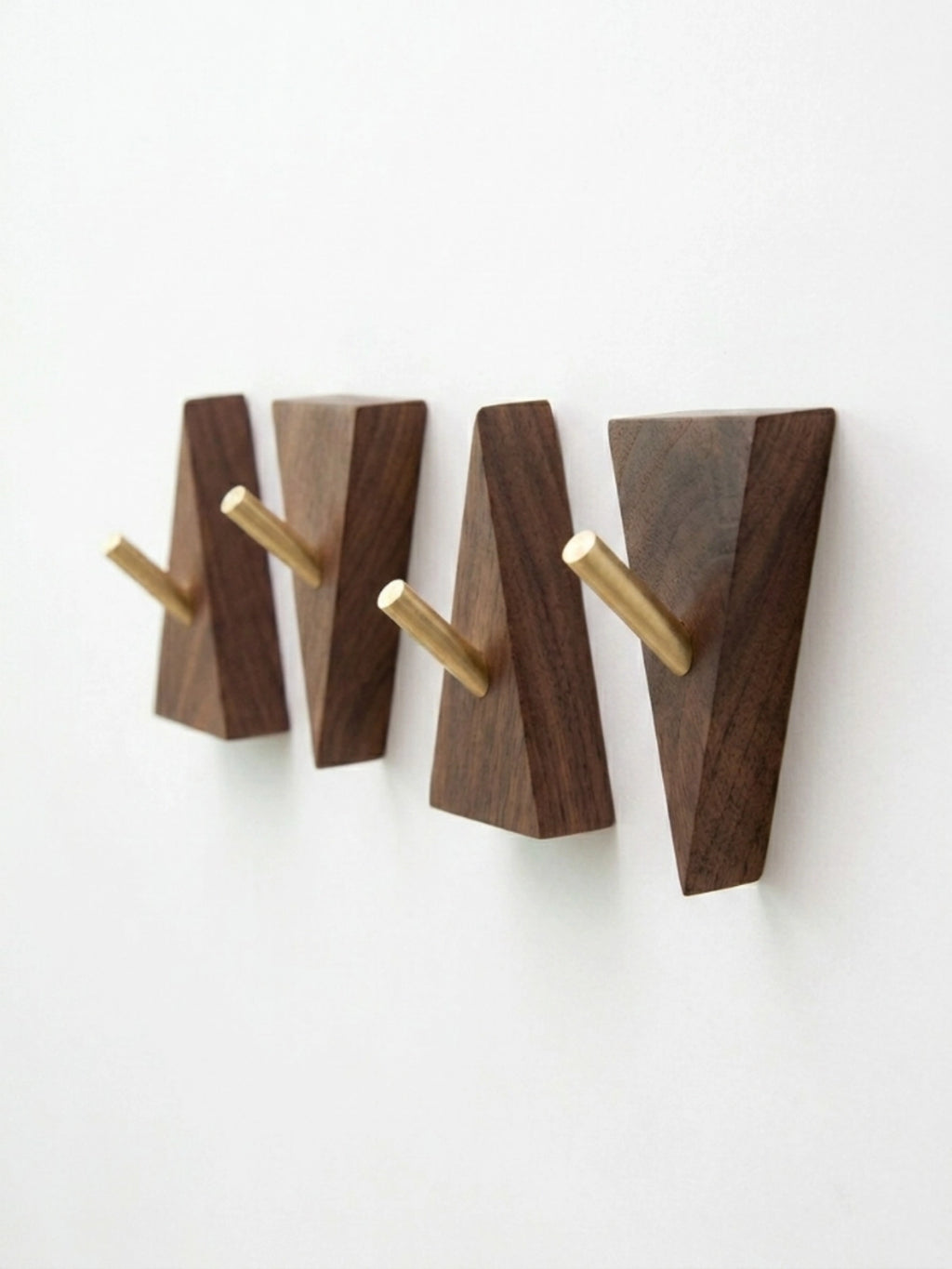Geometric walnut and brass wall hooks four piece set