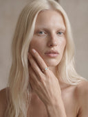 Model wearing the Avēro Aurora Garland delicate gold opal ring